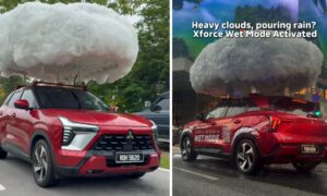 三菱は濡れた路面での走行をデモンストレーションするために、1台の車に雨を降らせます